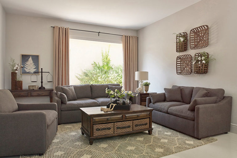 A modern living room with brand new furniture and a coffee table in Springfield, IL. Our consignment shop offers a wide variety of furniture pieces to choose from.