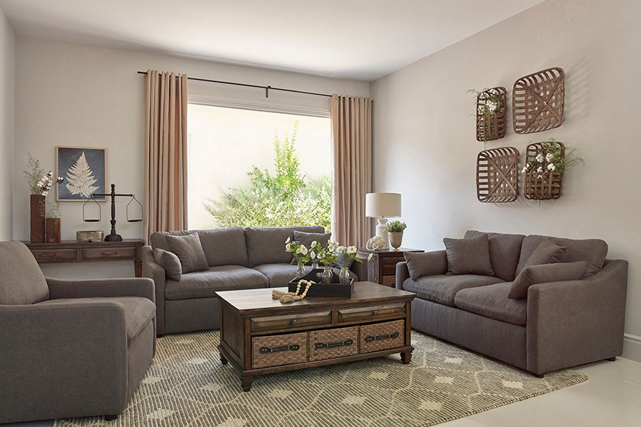 A modern living room with brand new furniture and a coffee table in Springfield, IL. Our consignment shop offers a wide variety of furniture pieces to choose from.