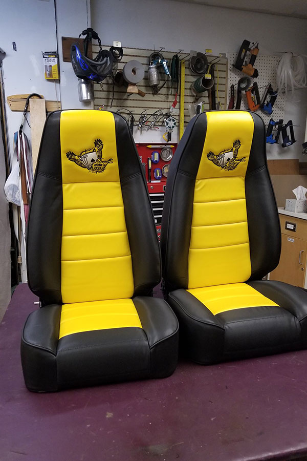 Yellow and black racing chairs that have been reupholstered by our experts In Springfield, IL with quality-made leather.